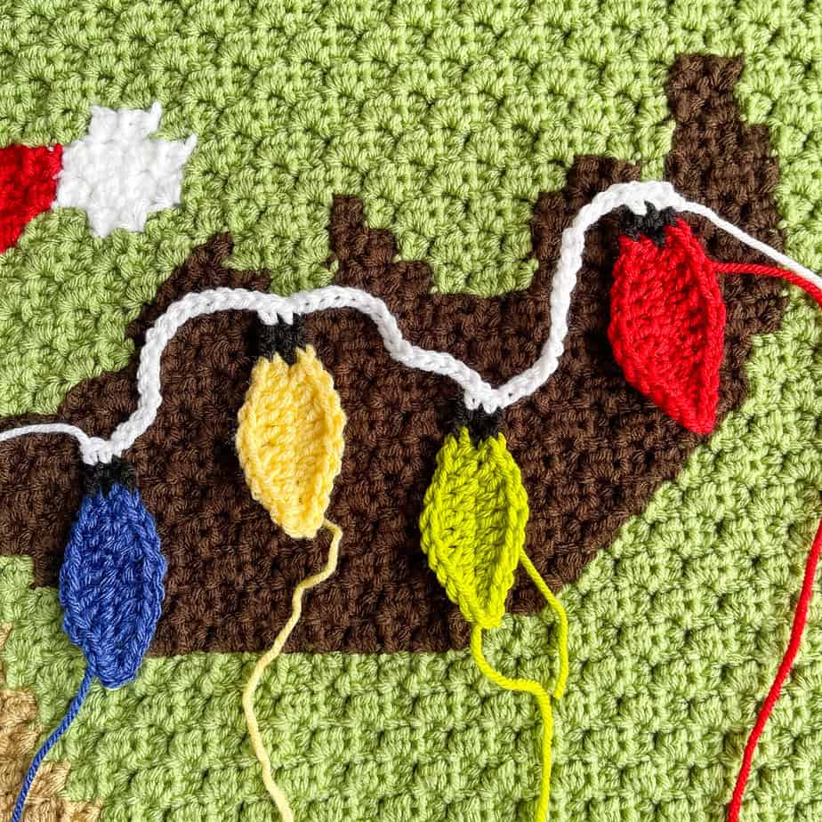 Sewing on Christmas crochet bulb strands