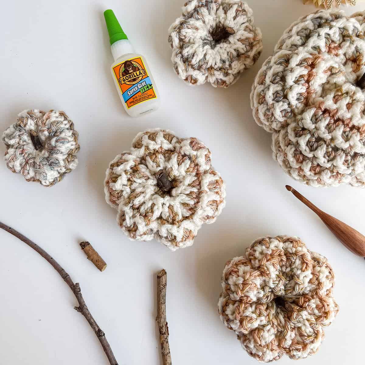 Cutting and gluing twigs for pumpkin stems