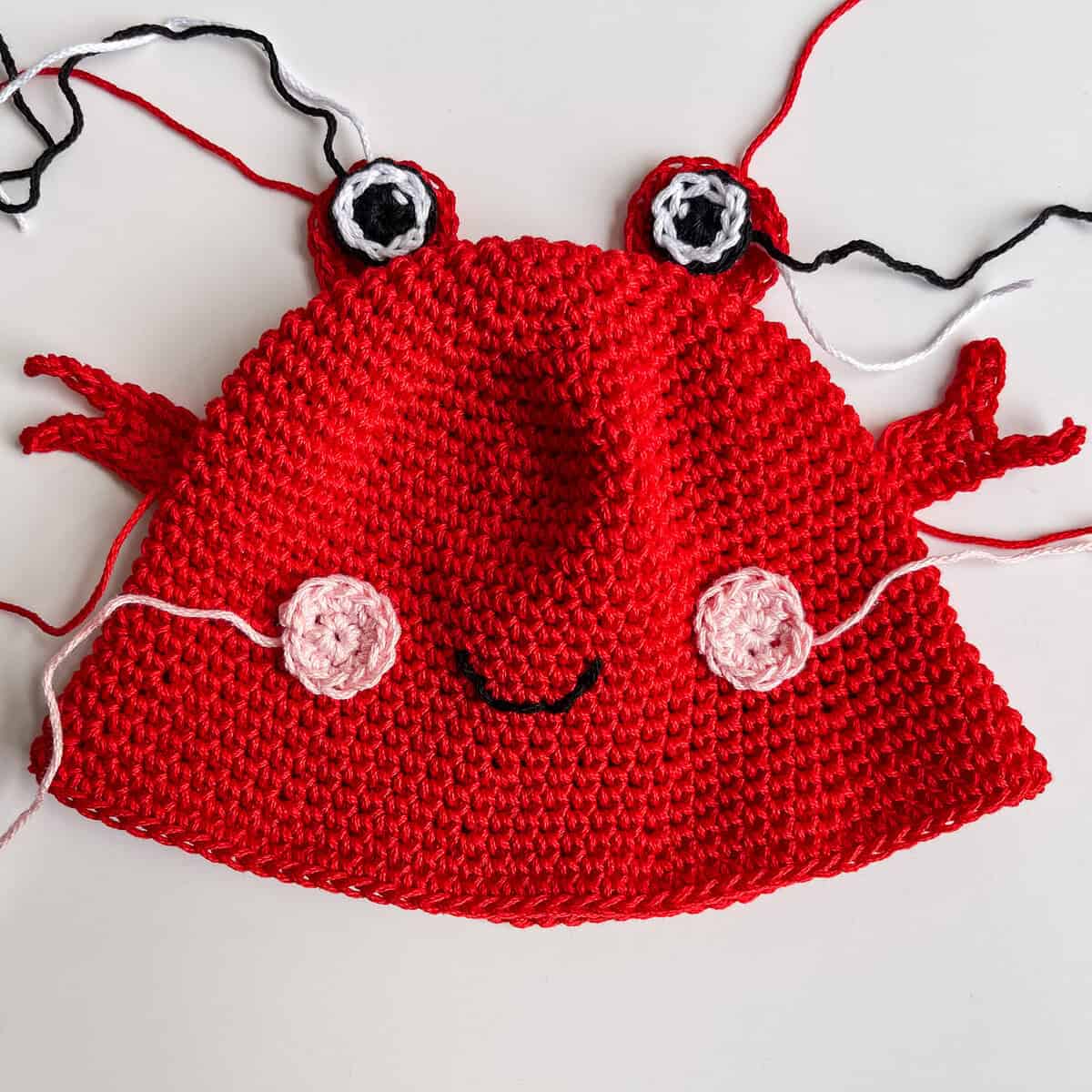sewing on appliques for Crab bucket hat